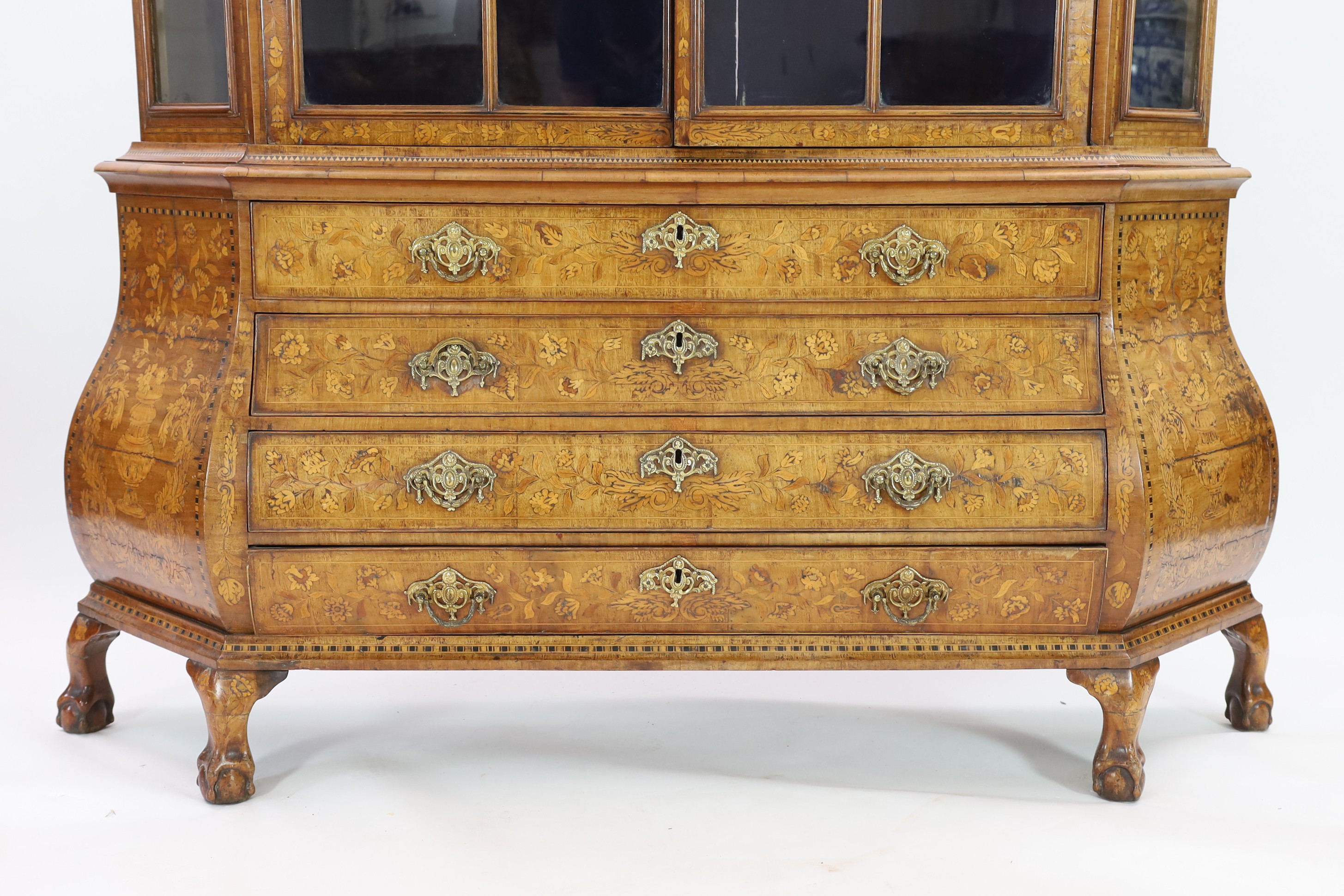 A 19th-century Dutch marquetry and walnut display cabinet Width 178cm. Height 240cm. Depth 36cm.